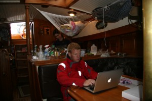 Paul Checking Weather Models, Jen Cooking